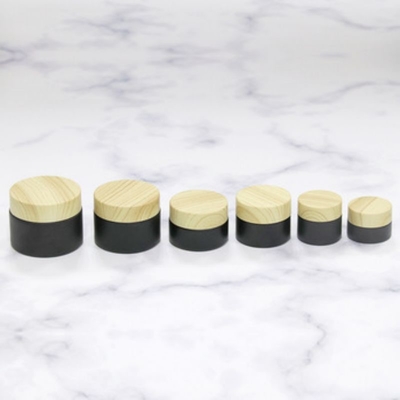 Draagbare 10g crème pot met houten dop voor persoonlijke verzorging Acceptabel klant logo