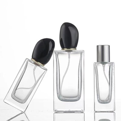 Vierkante glazen parfumfles met 50 ml 100 ml capaciteit en een kenmerkende onregelmatige kap